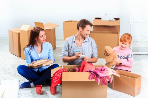 Professional movers handling office equipment