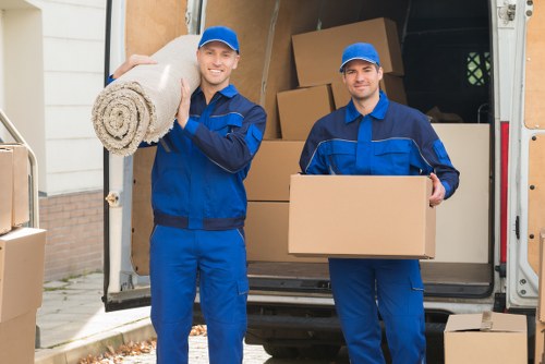 Professional movers handling household items in Paddington